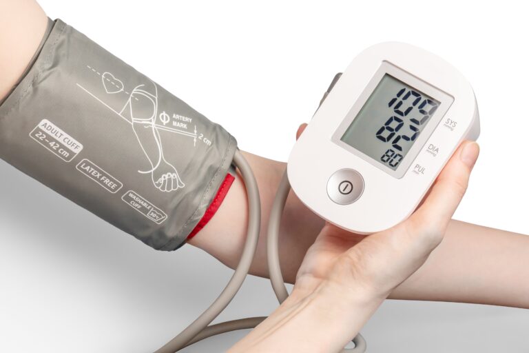Blood pressure monitor showing reading